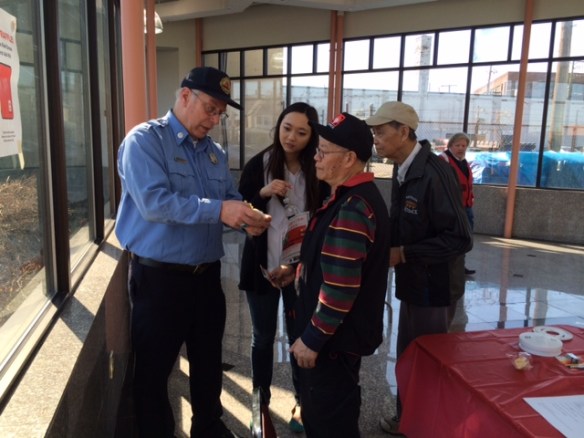 Volunteers presented fire safety demonstrations including battery installation for smoke detectors.
