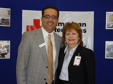 Lorain County Chapter Executive, Rita Campbell stands with Lorain County Chamber of Commerce President, Tony Gallo, during the March “Coffee, Tea and Contacts” networking event held at the chapter.