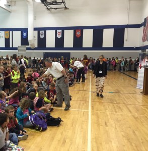 Tim Reichel fist bumps a Fairless Elementary student.
