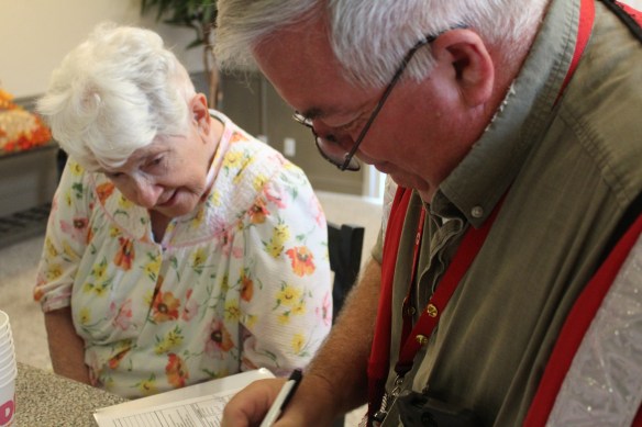 north-olmsted-ohio-resident-joan-kravets-assisted-by-red-cross-volunteer-mark-cline