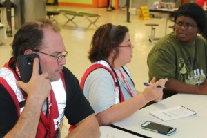 red-cross-volunteers-james-and-leween-mcintosh-assist-india-davis-at-a-shelter-in-bergaw-nc-after-her-house-was-destroyed-by-hurricane-matthew