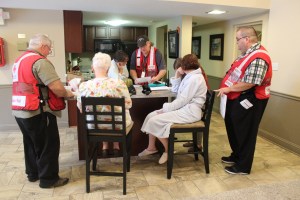 red-cross-volunteers-mark-cline-and-gary-grano-and-disaster-program-manager-jeremy-bayer-assist-clients-in-north-olmsted